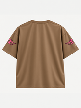 Back of brown Billy Bones Club boxy tee with pink tribal flame sleeve prints