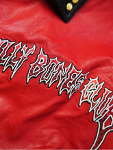 Close-up of Billy Bones Club embroidered gothic lettering on crimson leather jacket chest