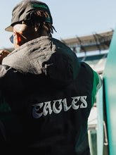 Back view of Philadelphia Eagles Starter jacket showing Eagles script lettering