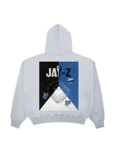 Grey JAY-Z hoodie with a large black and blue Yankee Stadium poster graphic and sold-out show dates on the upper back
