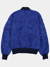 Tonal stitched Dodgers Champions artwork on a royal blue nylon bomber jacket with navy rib-knit collar and hem
