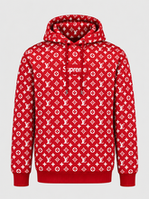 Red monogram-pattern pullover hoodie featuring a Supreme-style box logo on the front.
