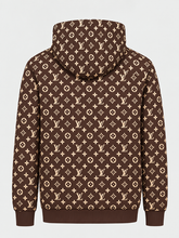 Back view of the brown monogram-pattern hoodie with an all-over repeating design.