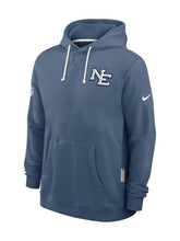 New England Patriots We Are All Patriots storm blue hoodie with embroidered NE chest logo, cream drawcords, kangaroo pocket and team shield on the sleeve