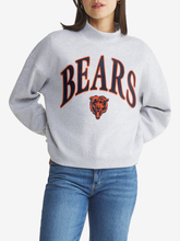 Woman wearing heather gray Chicago Bears mock neck pullover sweatshirt with arched navy and orange BEARS wordmark and Bears head logo on the front