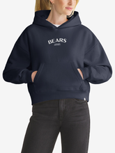 Woman wearing navy Chicago Bears foundation hoodie, front view with chest wordmark
