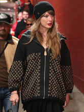 Taylor Swift wearing the Louis Vuitton monogram black hooded jacket with a black beanie