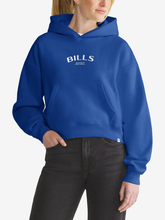 Woman wearing royal blue Buffalo Bills foundation hoodie, front view with chest wordmark