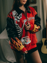 Model wearing Billy Bones Club crimson leather jacket with yellow flame cuffs and ribbed sleeves