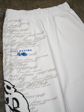 Close-up of sweatpants waistband with Civil Regime rose logo