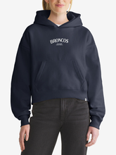 Woman wearing navy Denver Broncos foundation hoodie, front view with chest wordmark
