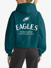 Back view of teal Philadelphia Eagles hoodie featuring eagle logo and wordmark graphic