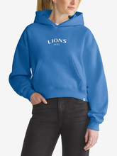 Woman wearing blue Detroit Lions foundation hoodie, front view with chest wordmark