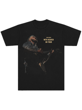Black tee with live concert photo of Zach Bryan playing guitar and gold tour text