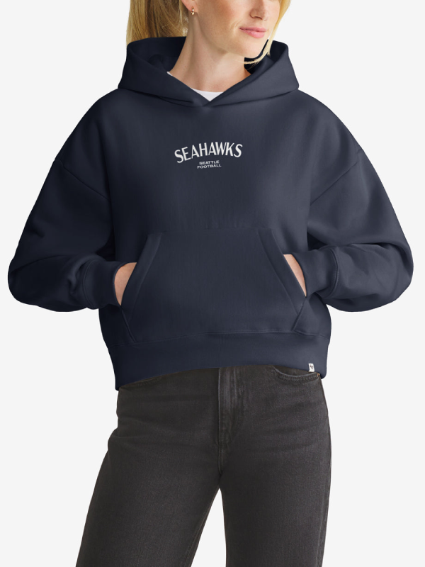 Woman wearing navy Seattle Seahawks foundation hoodie, front view with chest wordmark
