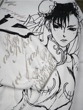 Close-up of Chun-Li illustration on white cropped hoodie