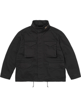 Front view of the black M65 field jacket showing the flap pockets and stand collar.