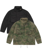 Black and green tie-dye Supreme x A Presse M65 field jackets shown together, front view with hoods removed.