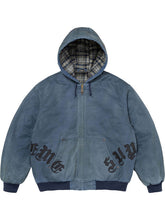 Blue washed cotton hooded jacket shown from the front, featuring plaid lining, zip closure, leather appliqué details and ribbed trim.