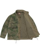 Green tie-dye field jacket shown open, revealing the twill lining and interior pocket.