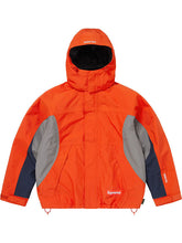 Supreme Peace Gore-Tex jacket in orange colorblock with hood up, shown from the front with the Supreme box logo on the chest.