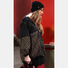 Taylor Swift in a Louis Vuitton monogram jacket at the Bills vs Chiefs game