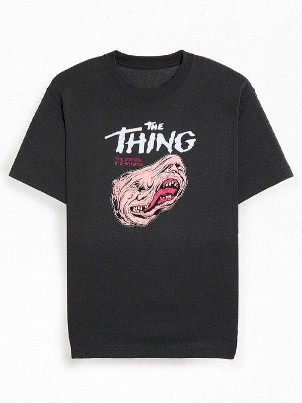 Front view of black t-shirt with The Thing movie logo and melting face graphic