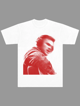 White tee with red duotone photo of Zach Bryan playing guitar