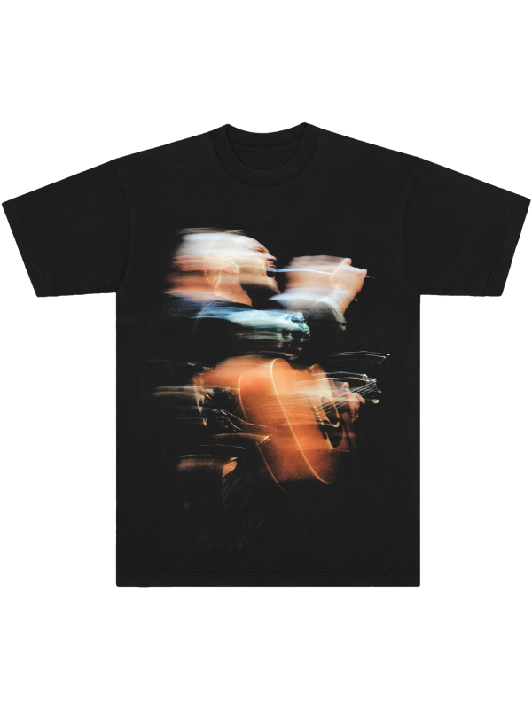 Black tee with blurred concert photo of Zach Bryan playing guitar